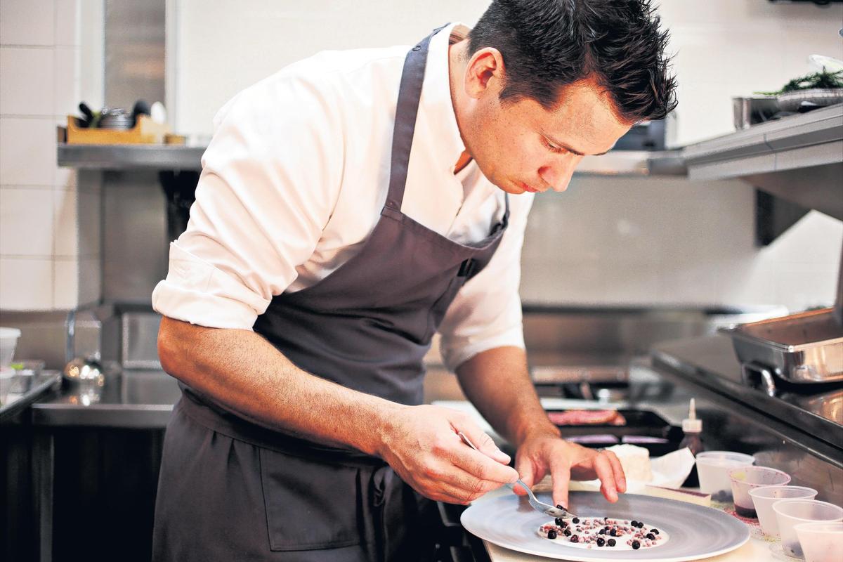 Herons’ executive chef Steven Devereaux Greene, a two-time James Beard semifinalist for Best Chef in the Southeast, plates a dish from the eight-course tasting menu called “The Art Tour” on Thursday, July 26, 2018.