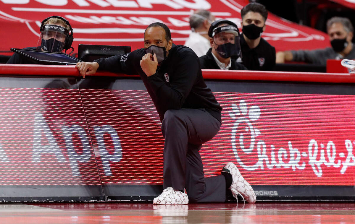 N.C. State head coach Kevin Keatts watches his team play during the first half of N.C. State’s game against Virginia at PNC Arena in Raleigh, N.C., Wednesday, February 3, 2021.