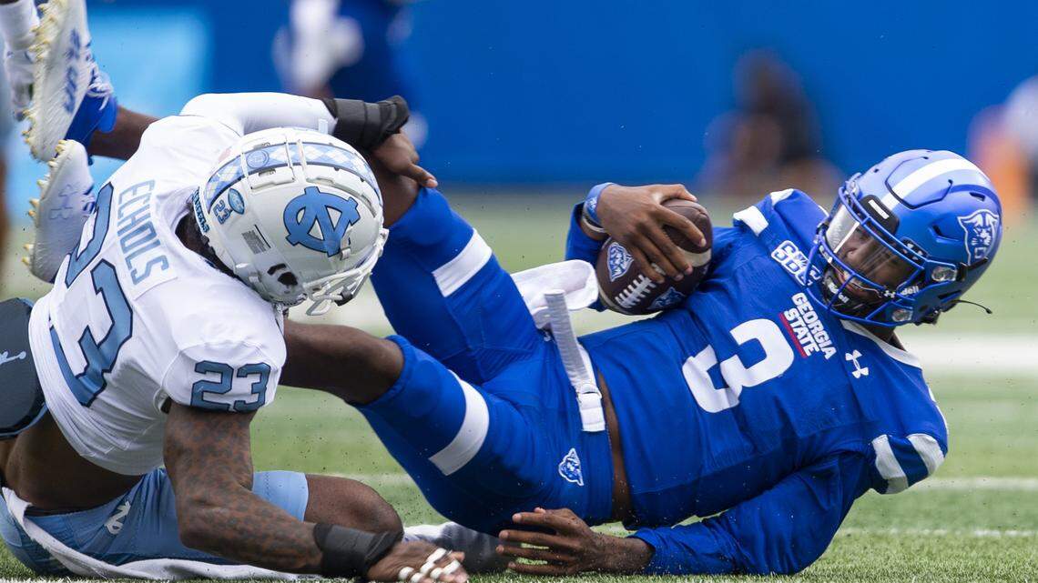 North Carolina linebacker Power Echols tackles Georgia State quarterback Darren Grainger (3) in the first half of an NCAA college football game Saturday, Sept. 10, 2022, in Atlanta.