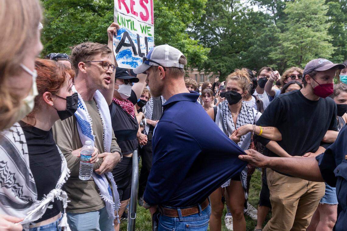 Pro-Palestinian demonstrators clash with police after replacing an American flag with a Palestinian flag Tuesday, April 30, 2024 at UNC-Chapel Hill. Police removed a “Gaza solidarity encampment” earlier Tuesday morning.