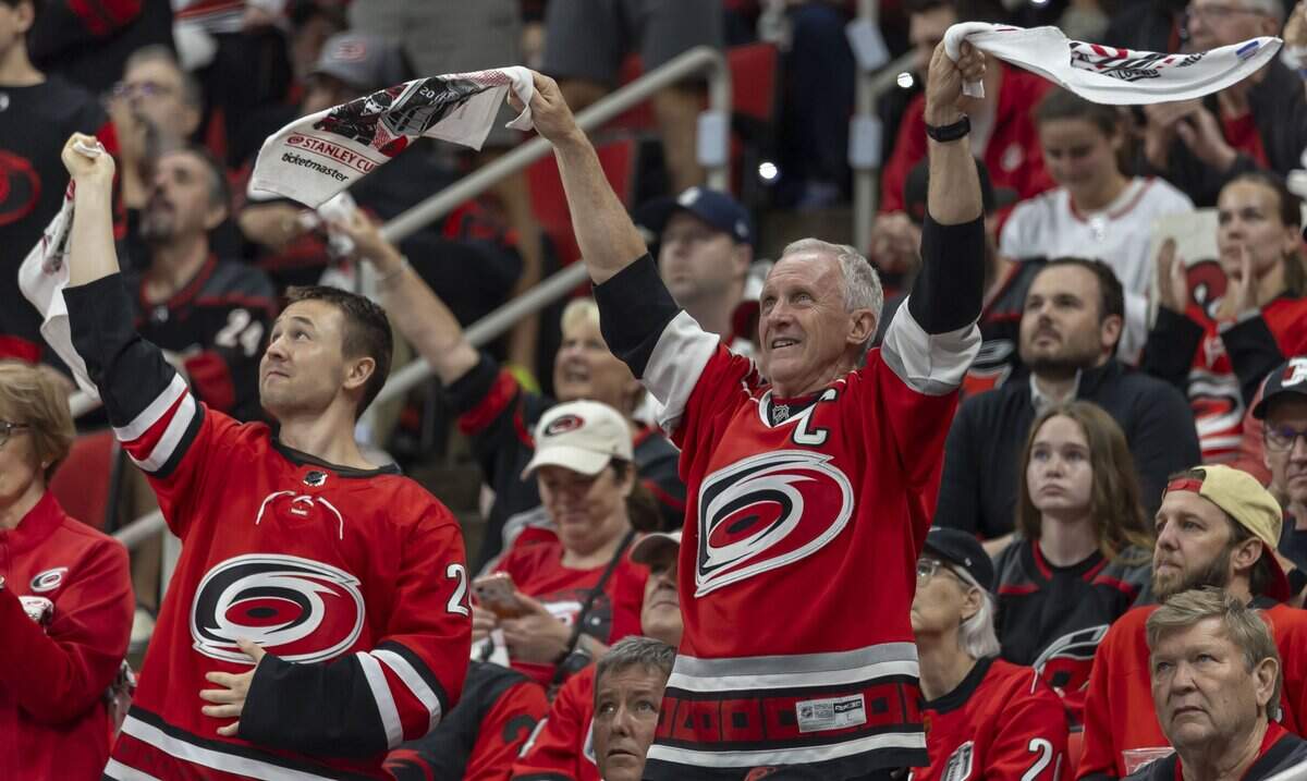 Carolina Hurricanes fans celebrates after a goal by center Jordan Staal (11) to tie the score 1-1 in the first period in Game 5 of the Stanley Cup Final against Vegas, on Thursday, June 11, 2026 at Lenovo Center in Raleigh, N.C.