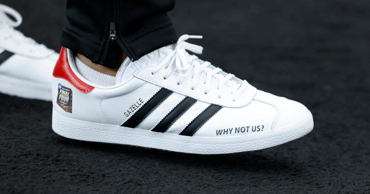 N.C. State head coach Kevin Keatts wears custom sneakers as seen after the Wolfpack’s practice at State Farm Stadium in Glendale, Ariz., Friday, April 5, 2024. The Wolfpack will face Purdue in the NCAA Tournament national semifinals Saturday.