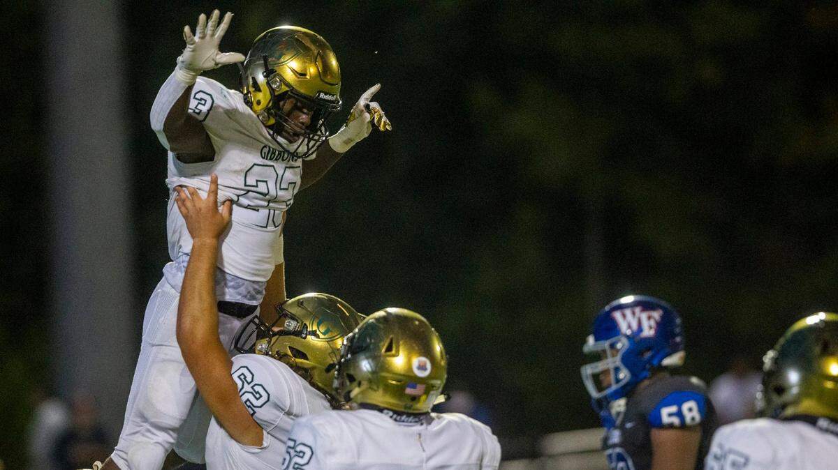 Cardinal Gibbonss Donovan Shepard (23) celebrates a touchdown against Wake Forest during the second half Friday, Sept. 10, 2021 at Cardinal Gibbons High School in Raleigh. Cardinal Gibbons won 33-9.