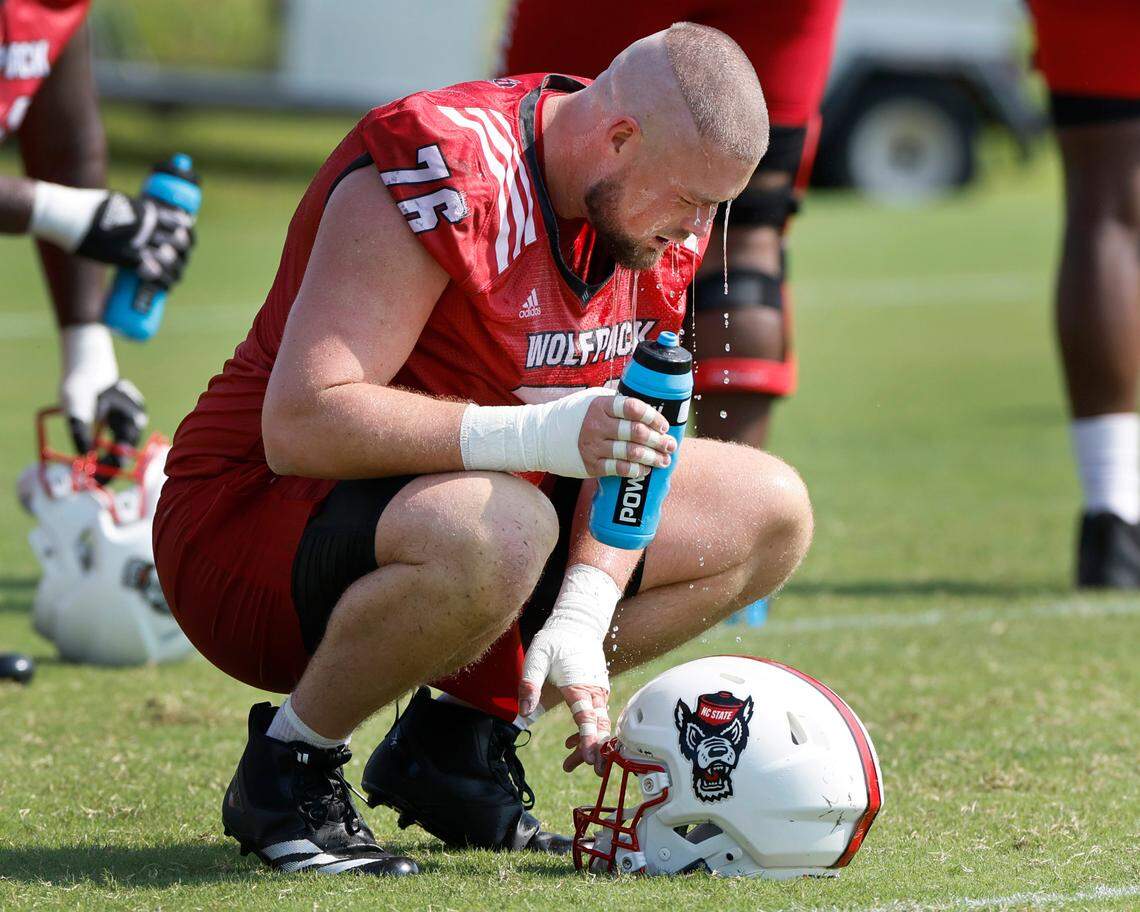 N.C. State offensive lineman Patrick Matan (76) cools down during the Wolfpack’s first practice in Raleigh, N.C., Wednesday, July 31, 2024.