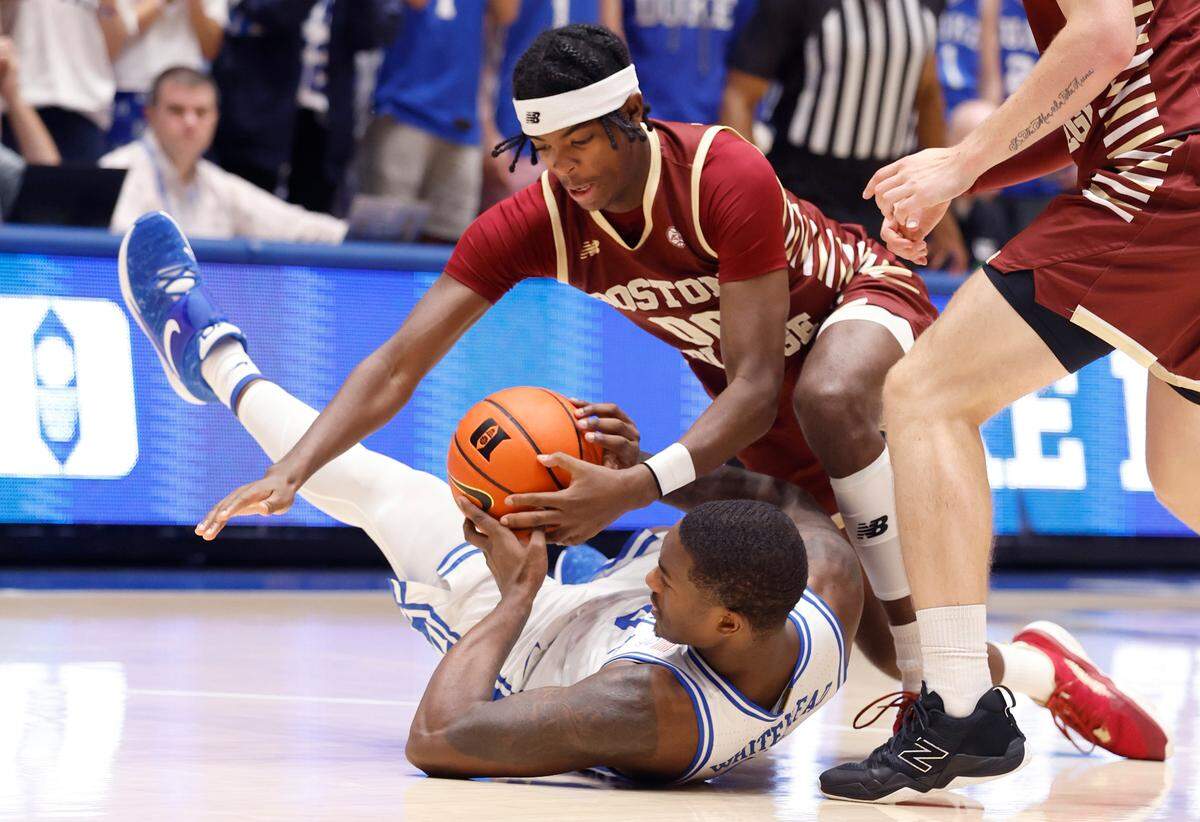 Duke’s Dariq Whitehead (0) pulls in the loose ball from Boston College’s Chas Kelley (00) during the second half of Duke’s 75-59 victory over Boston College at Cameron Indoor Stadium in Durham, N.C., Saturday, Dec. 3, 2022.