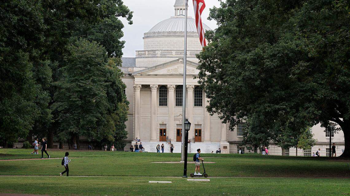 People walk through Polk Place on the campus of UNC-Chapel Hill on Wednesday, Sept. 4, 2024. University and athletic officials are considering adding concerts, student tailgates and a beer garden in the area ahead of the 2025 football season.