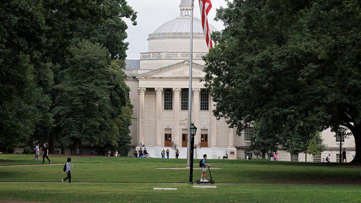 People walk through Polk Place on the campus of UNC-Chapel Hill on Wednesday, Sept. 4, 2024.