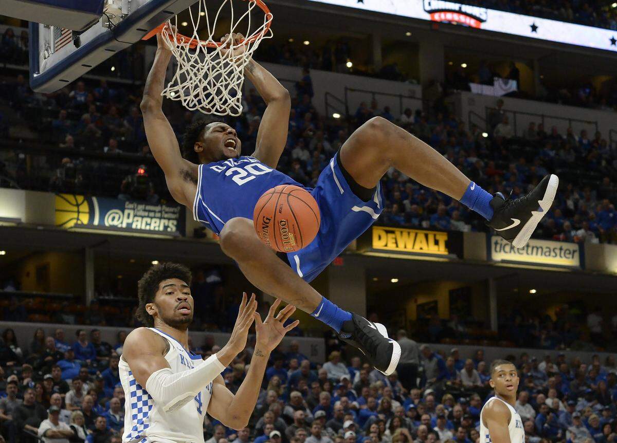 Duke center Marques Bolden (20) slams a second half dunk over Kentucky forward Nick Richards (4). Duke defeated Kentucky 118-84 in the Champions Classic at the Bankers Life Fieldhouse in Indianapolis, Indiana, Tuesday, Nov. 6, 2018.