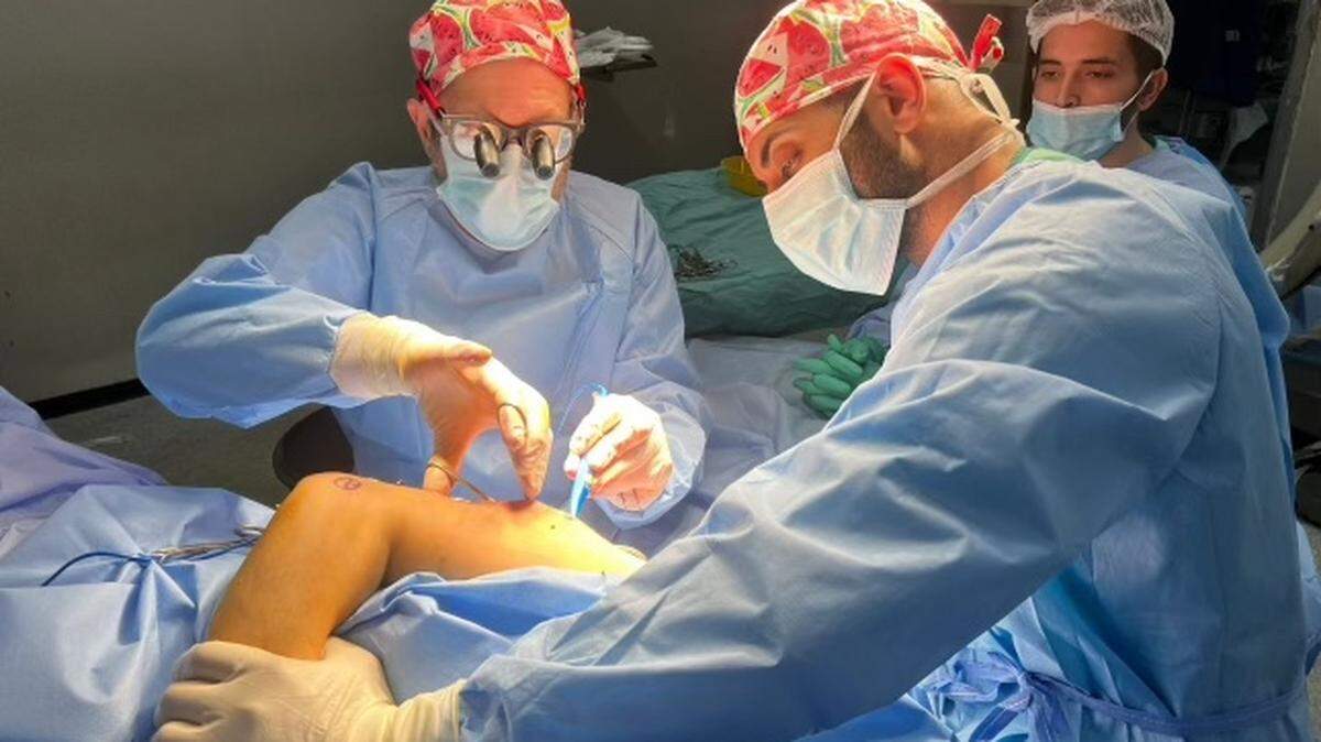 Dr. Mark Perlmutter of Rocky Mount (left) and Dr. Feroze Sidhwa of Stockton, Calif., operating on a patient in Gaza. (Photo courtesy of Mark Perlmutter)