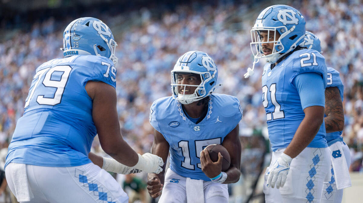 North Carolina quarterback Conner Harrell (15) celebrates after scoring as touchdown on a 4-yard run in the second quarter against Charlotte on Saturday, September 7, 2024 at Kenan Stadium in Chapel Hill, N.C.