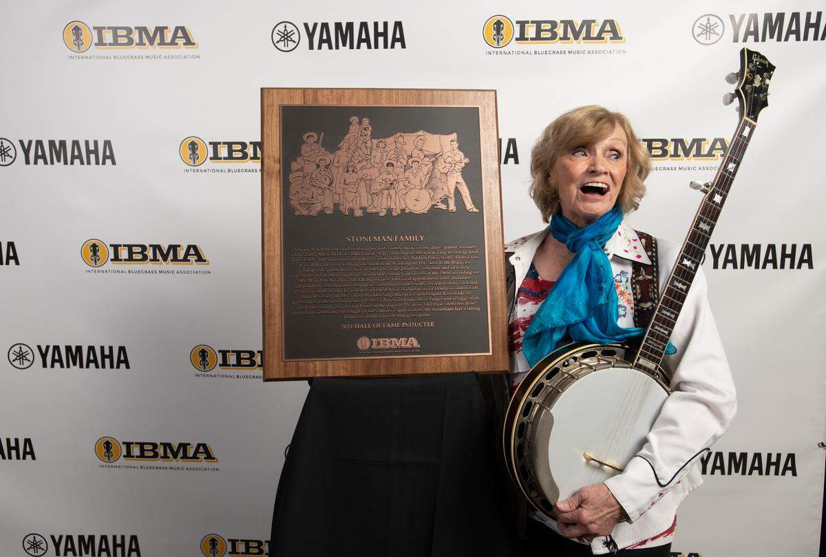 Ronnie Stoneman poses with the plaque honoring bluegrass pioneers The Stoneman Family, who were inducted into the Bluegrass Hall of Fame at the 32nd Annual IBMA Bluegrass Music Awards in Raleigh, N.C., Thursday night, Sept. 30, 2021.