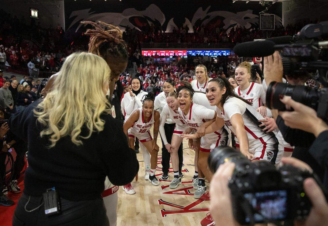 N.C. State players react as Saniya Rivers gives an interview following the Wolfpack’s 92-81 win over UConn on Sunday, Nov. 12, 2023, at Reynolds Coliseum in Raleigh, N.C. Rivers led the team with 33 points, 10 rebounds and 5 assists.