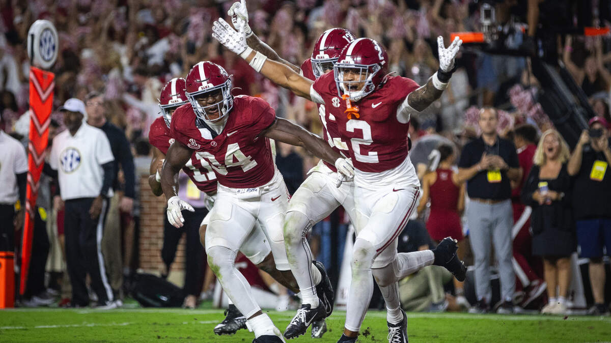Sep 28, 2024; Tuscaloosa, Alabama, USA; Alabama Crimson Tide defensive back Zabien Brown (2) and linebacker Que Robinson (34) celebrate after an interception against the Georgia Bulldogs in the fourth quarter at Bryant-Denny Stadium.