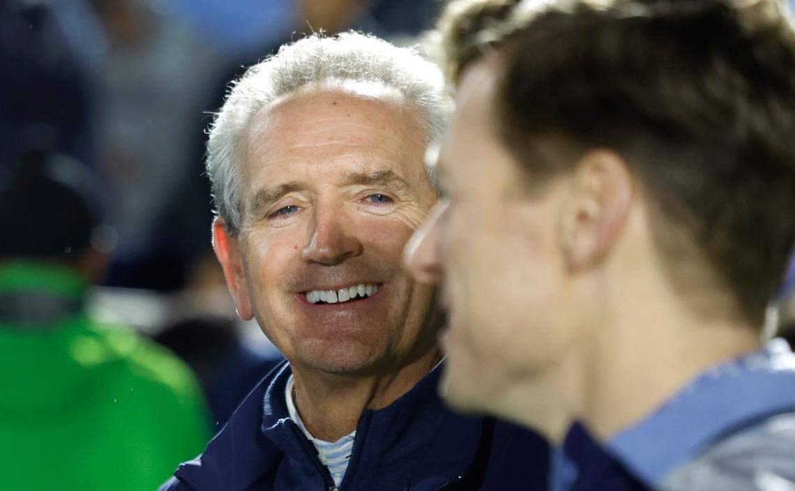 North Carolina athletics director Bubba Cunningham talks with Chancellor Lee Roberts after UNC’s 1-0 victory over Wake Forest in the finals of the 2024 Women’s College Cup at WakeMed Soccer Park in Cary, N.C., Monday, Dec. 9, 2024.