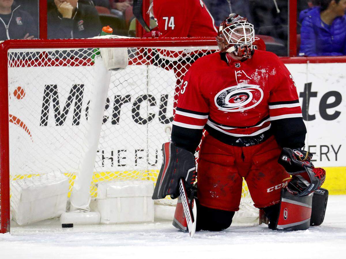 The Canes'  Scott Darling (33) watches the replay on the scoreboard after he gave up a goal during the first period of an NHL game played between the Carolina Hurricanes and the Edmonton Oilers on March 20,  2018.   The Oilers beat the Canes 7-3.