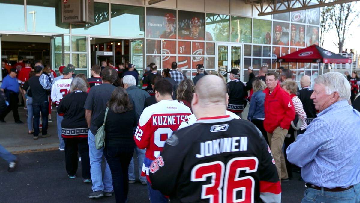 Fans line up to enter PNC Arena before the Carolina Hurricanes’ game against the Washington Capitals in Raleigh, N.C., Monday, April 15, 2019.