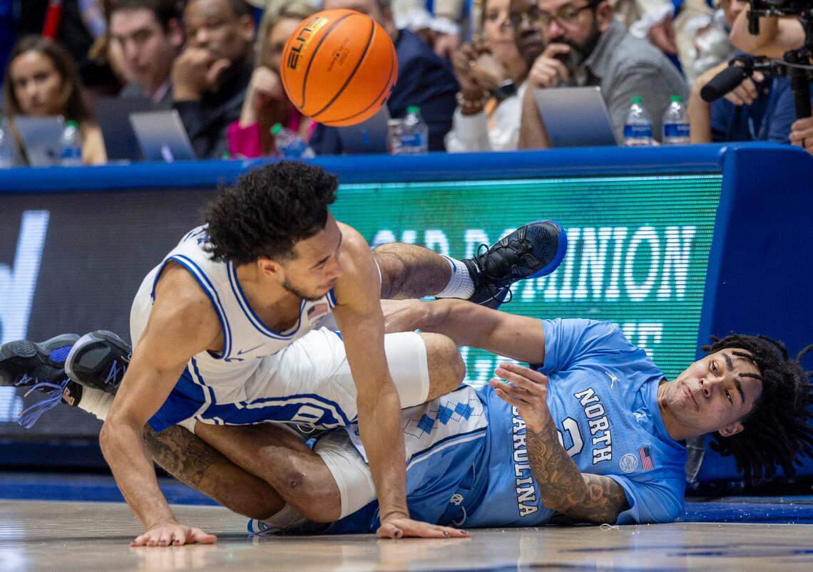 North Carolina’s Elliot Cadeau (2) makes a steal and a save against Duke’s Jared McCain (0) in the second half on Saturday, March 9, 2024 at Cameron Indoor Stadium in Durham, N.C.