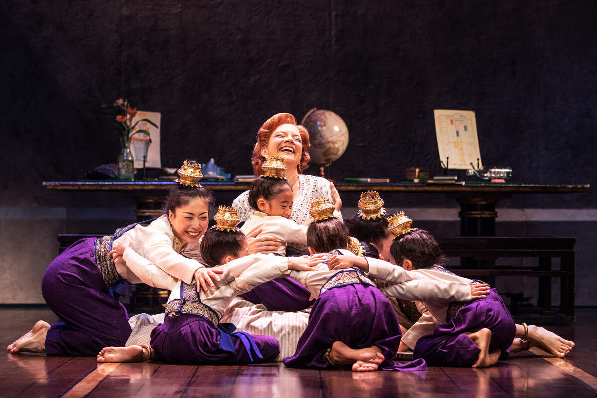 Angela Baumgardner as Anna Leonowens and the Royal Children in Rodgers & Hammerstein’s “The King and I.”