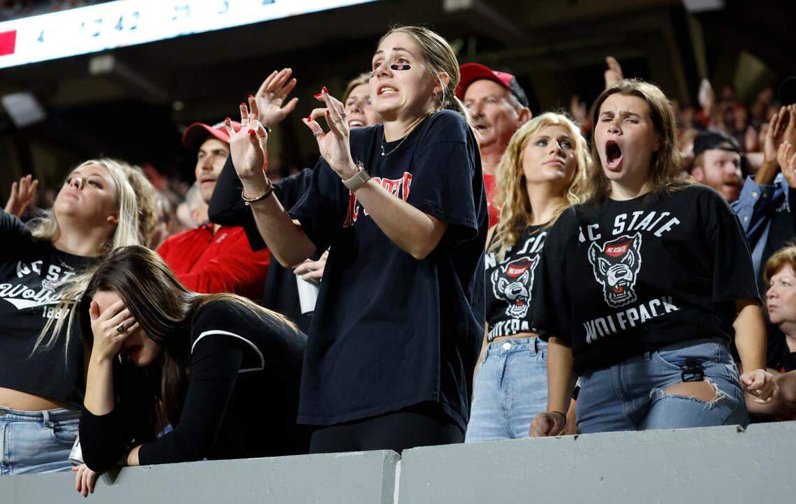 Wolfpack fans react to a call by the officials that negated a N.C. State stop on third down during the second half of Syracuse’s 24-17 victory over N.C. State at Carter-Finley Stadium in Raleigh, N.C., Saturday, Oct. 12, 2024.