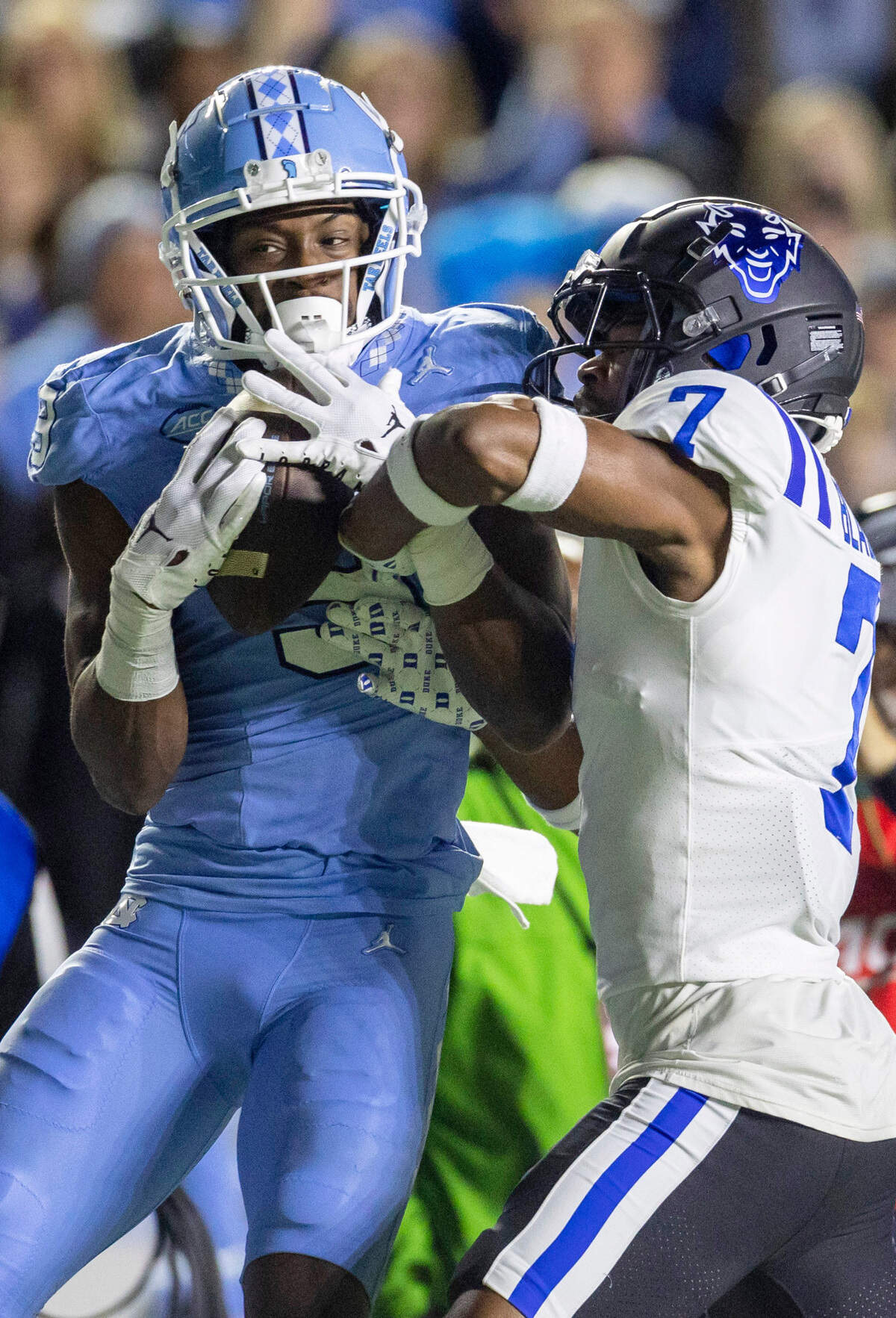 North Carolina wide receiver Devontez Walker (9) pulls in a 43-yard pass from quarterback Drake Maye against Duke defender Al Blades Jr. (7) in the first quarter on Saturday, Nov. 11, 2023 at Kenan Stadium in Chapel Hill, N.C.