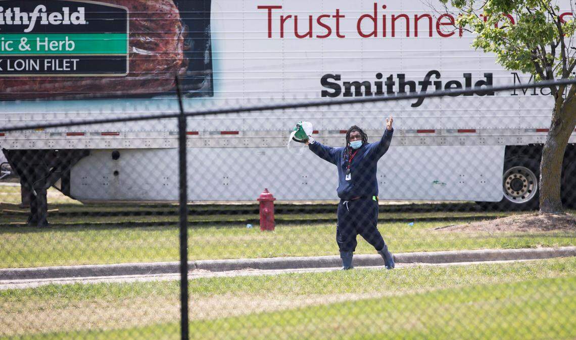 A Smithfield Foods employee poses as he leaves a shift at the processing plant in Tar Heel, N.C. on Thursday, May 7, 2020.