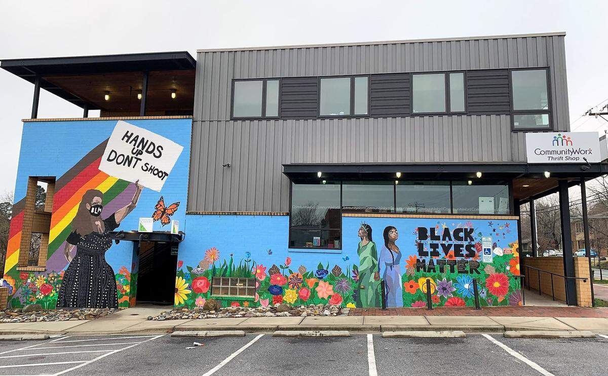 Artist Tyrone Smalls worked with students Ash Granda-Bondurant, Carina Rockart, Theo Preston and Cyani Jacobs to paint this Black Lives Matter mural on the wall of CommunityWorx, located at the intersection of Jones Ferry Road and West Main Street in Carrboro.