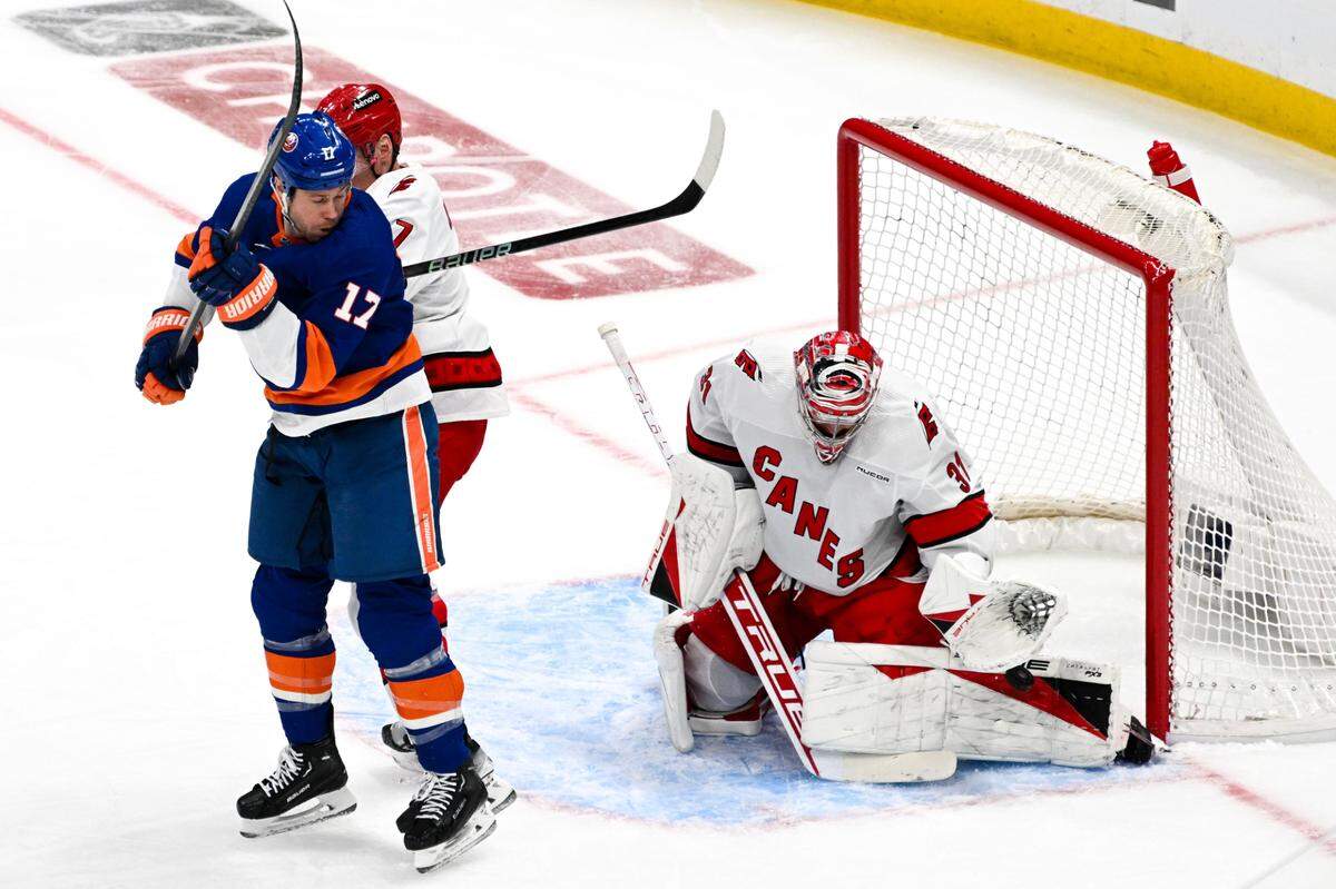 Apr 25, 2024; Elmont, New York, USA; Carolina Hurricanes goaltender Frederik Andersen (31) makes a save against the New York Islanders during the first period in game three of the first round of the 2024 Stanley Cup Playoffs at UBS Arena. Mandatory Credit: Dennis Schneidler-USA TODAY Sports