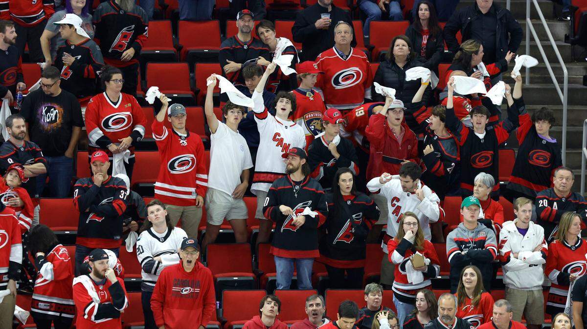 Fans cheer on the Canes during the third overtime of the Hurricanes’ game against the Florida Panthers in the first game of Eastern Conference Finals at PNC Arena in Raleigh, N.C., early Friday morning, May 19, 2023.