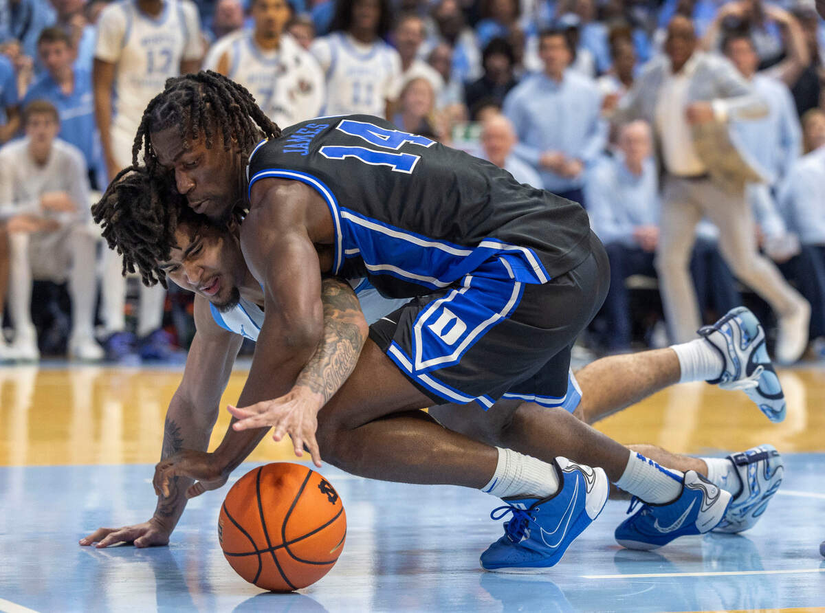 Duke’s Sion James (14) and North Carolina’s Elliot Cadeau (3) battles for the ball in the second half on Saturday, March 8, 2025 at the Smith Center in Chapel Hill, N.C.