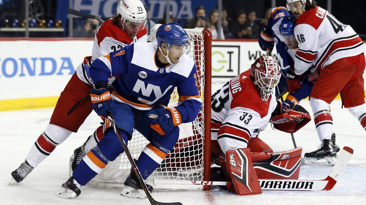 New York Islanders right wing Jordan Eberle (7) skates around Carolina Hurricanes goaltender Scott Darling (33) in the second period of an NHL hockey game Saturday, Nov. 24, 2018, in New York.