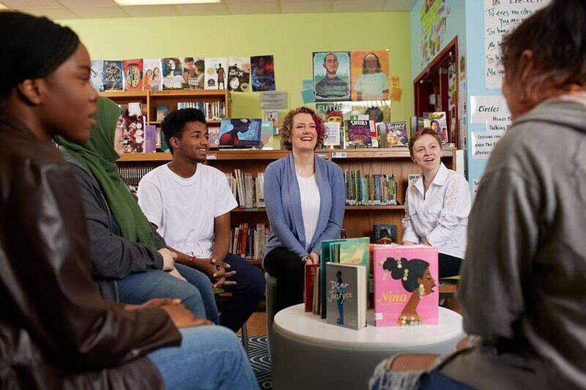 Julie Stivers, center, librarian at Mount Vernon Middle School in Raleigh, has been named the 2023 School Librarian of the Year by School Library Journal and sponsored by Scholastic.