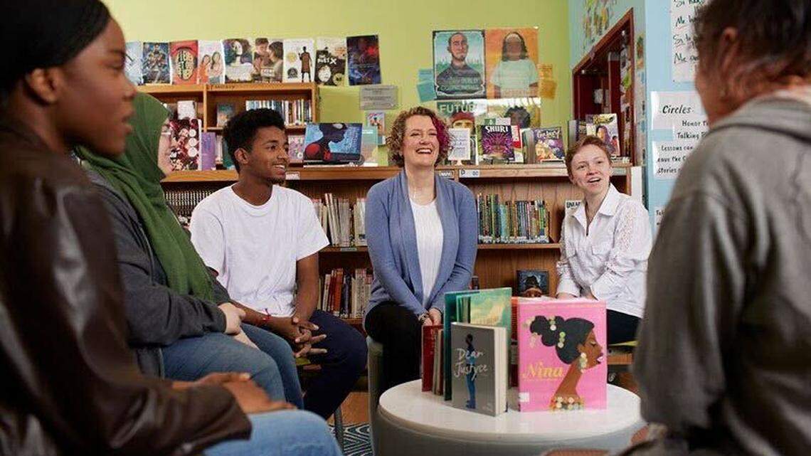 Julie Stivers, center, librarian at Mount Vernon Middle School in Raleigh, has been named the 2023 School Librarian of the Year by School Library Journal and sponsored by Scholastic.