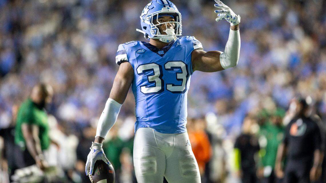 North Carolina’s Cedric Gray (33) reacts after intercepting Miami quarterback Tyler Van Dyke in the third quarter on Saturday, October 14, 2023 at Kenan Stadium in Chapel Hill, N.C.