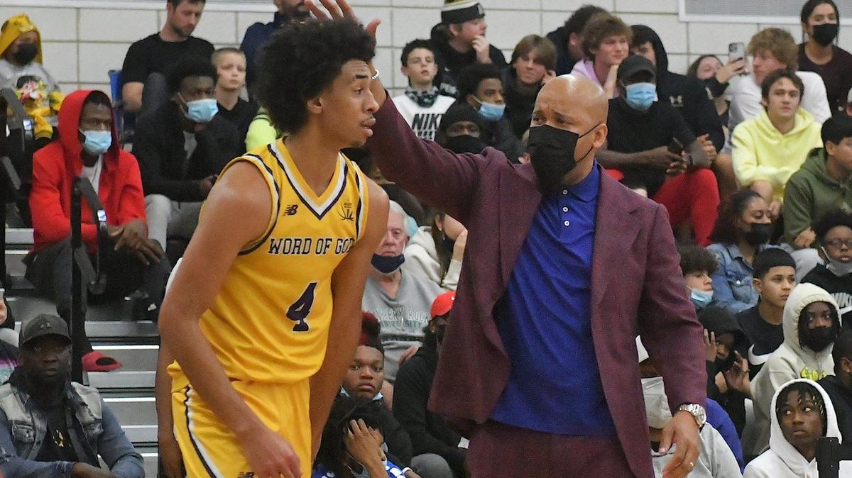 Word of God Head coach Byron Williams congratulates Freddie Dilione (4) after a play during the first half. The Word of God Holy Rams and the Combine Academy Goats met in the John Wall Holiday Classic in Raleigh, N.C. on December 29, 2021