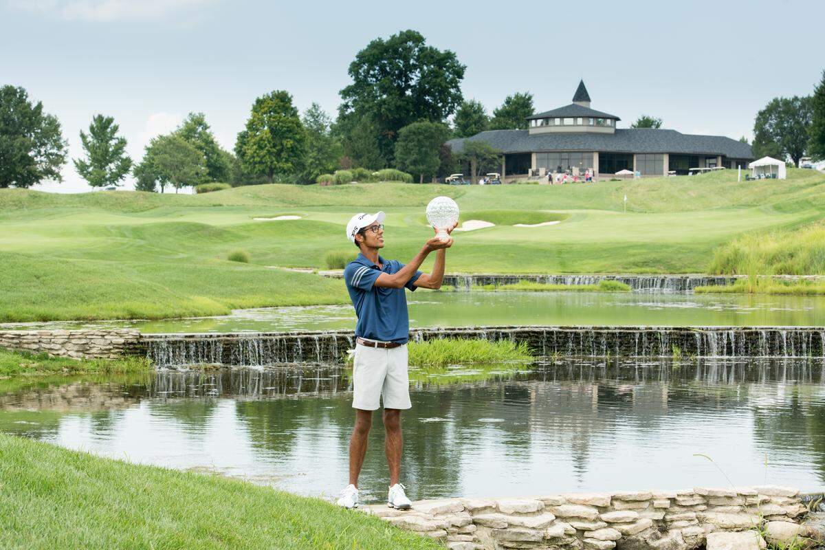 Akshay Bhatia of Wake Forest shows off the Jack Nicklaus Trophy after winning his second straight Boys Junior PGA Championship on Friday, August 3, 2018.