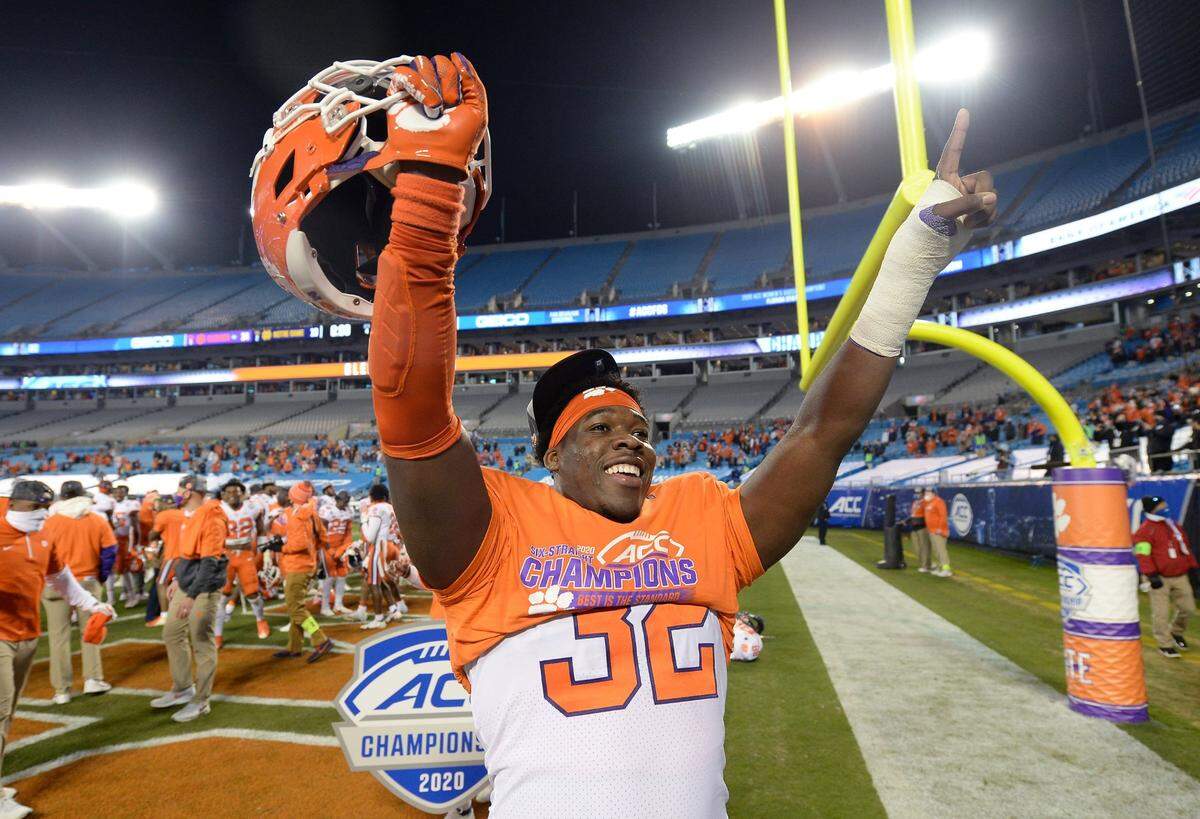 Clemson Tigers defensive tackle Etinosa Reuben celebrates the teamÕs victory in the ACC Championship game. Clemson defeated Notre Dame 34-10 to win the championship at Bank of America Stadium in Charlotte, NC on Saturday, December 19, 2020.