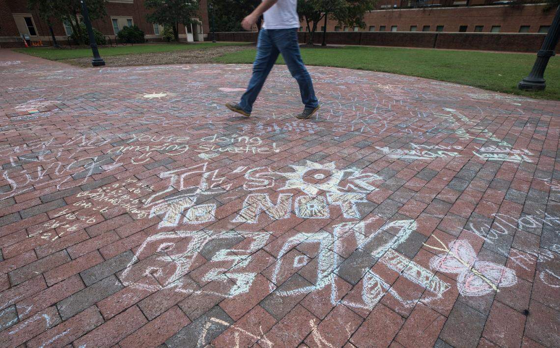 Messages of support and encouragement can be seen written in chalk on UNC-Chapel Hill’s south campus on Oct. 12, 2021.