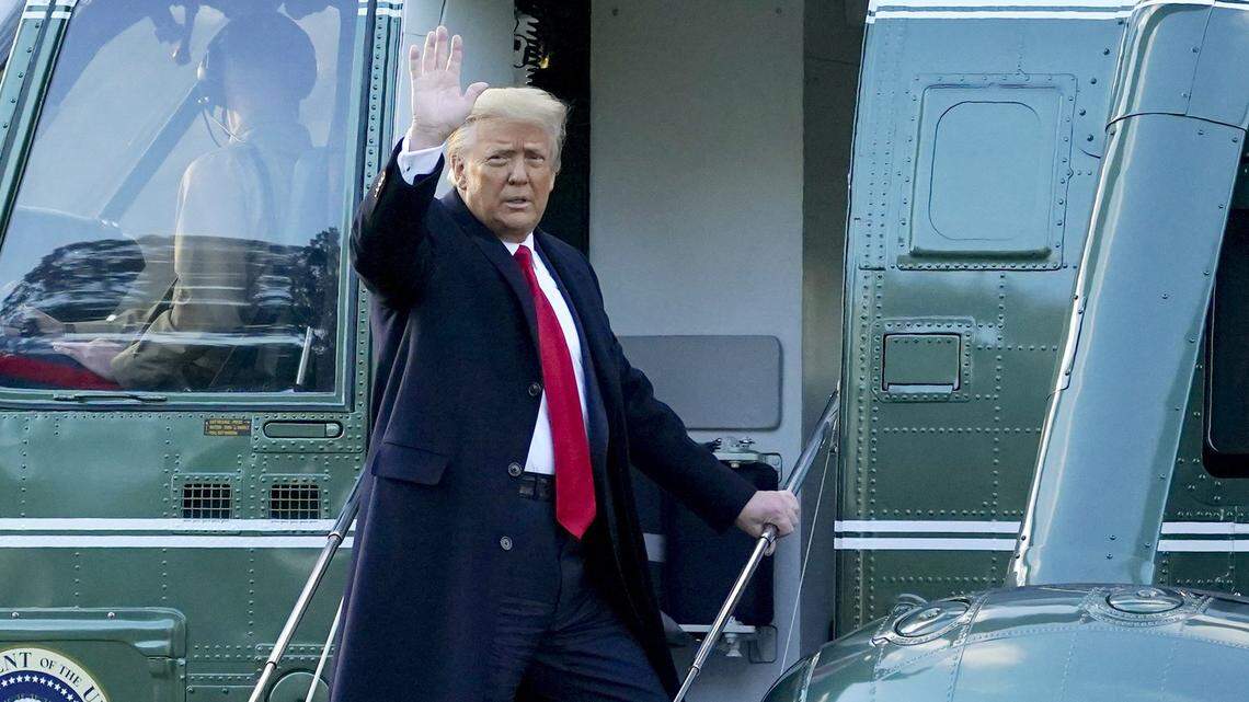 President Donald Trump waves as he boards Marine One on the South Lawn of the White House, Wednesday, Jan. 20, 2021, in Washington. Trump is en route to his Mar-a-Lago Florida Resort.