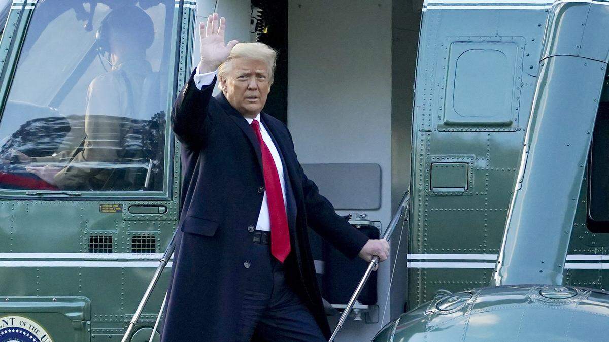 President Donald Trump waves as he boards Marine One for a final time upon leaving office in January 2021.