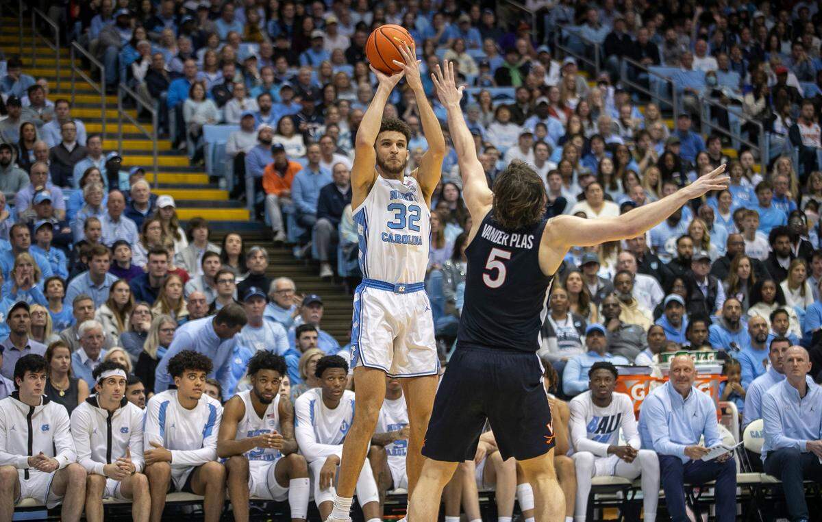 North Carolina’s Pete Nance (32) put up a shot against Virginia’s Ben Vander Plas (5) in the second half on Saturday, February 25, 2023 at the Smith Center in Chapel Hill, N.C.