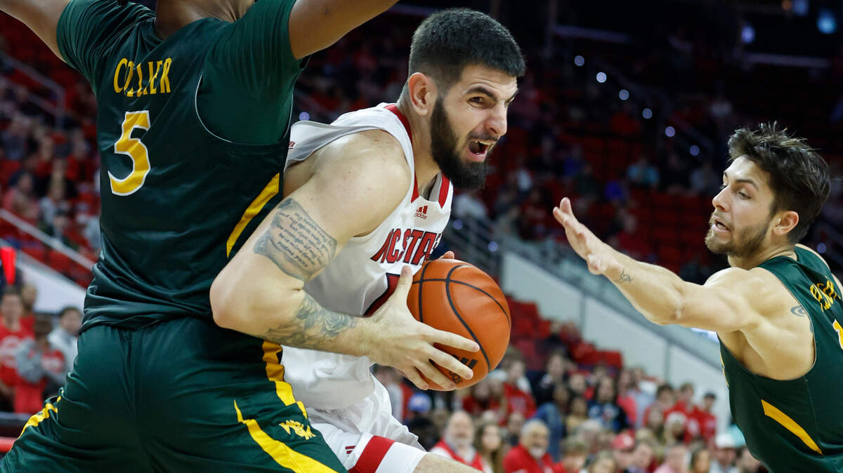 N.C. State’s Dusan Mahorcic (11) gets around William & Mary’s Noah Collier (5) during the second half of N.C. State’s 85-64 victory over William & Mary at PNC Arena in Raleigh, N.C., Tuesday, Nov. 29, 2022.