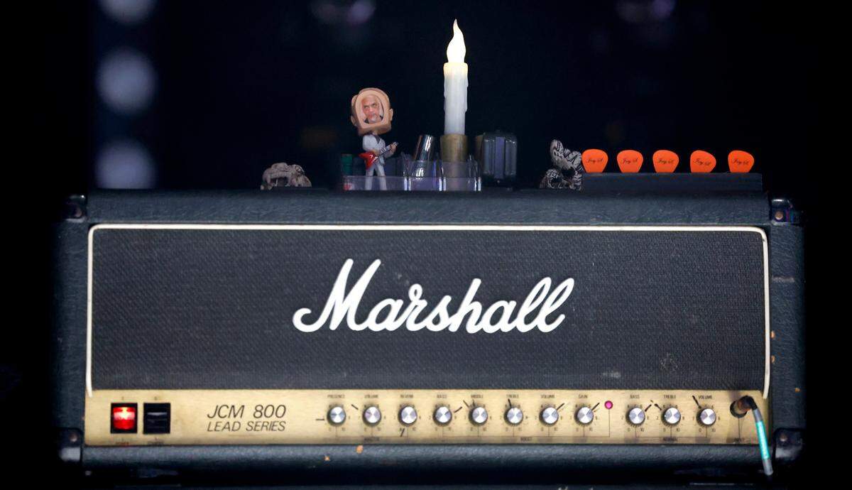 Guitar picks and trinkets are set up before the Pixies play at Red Hat Amphitheater in Raleigh, N.C., during their North American tour on Friday, June 16, 2023.