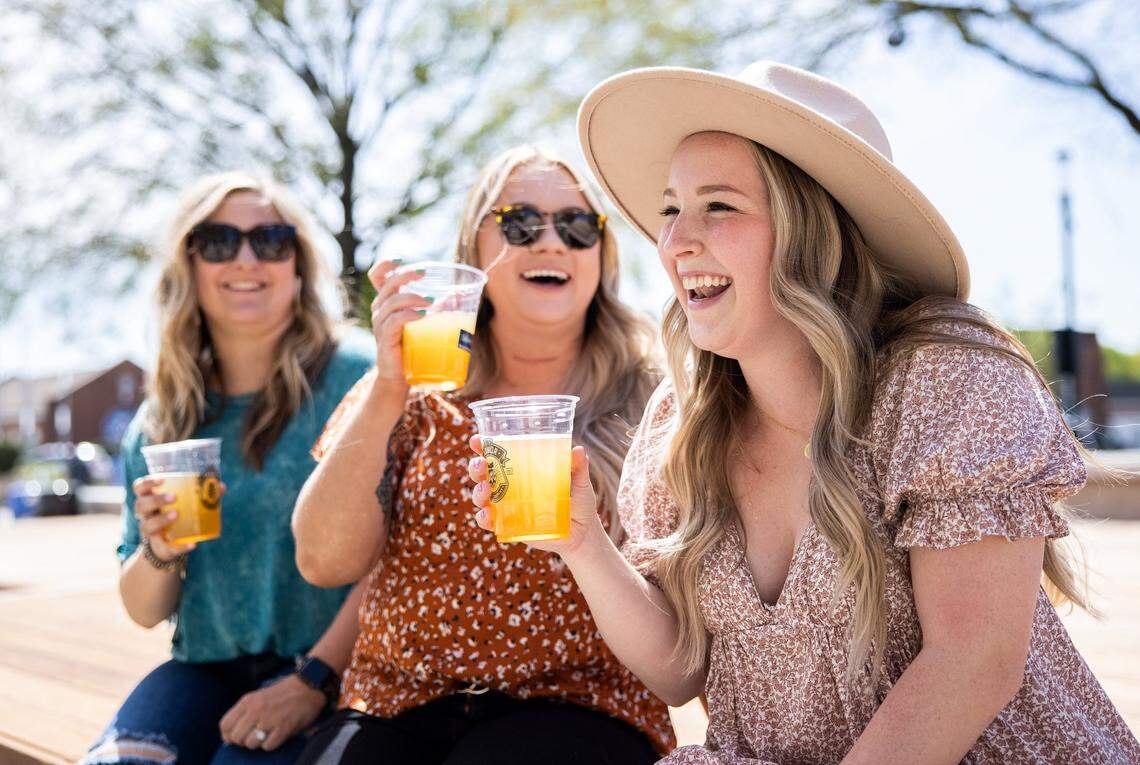 Until recently, grocery stores and restaurants were also banned from selling any sort of alcohol on Sunday until the clock struck noon. A recent compromise at the legislature lowered it to 10 a.m., but also allowed individual counties to reject the change. Here, Taylor Cranford, Nicole Smith and Peyton Nance share a laugh over a beer in Kannapolis in 2022.