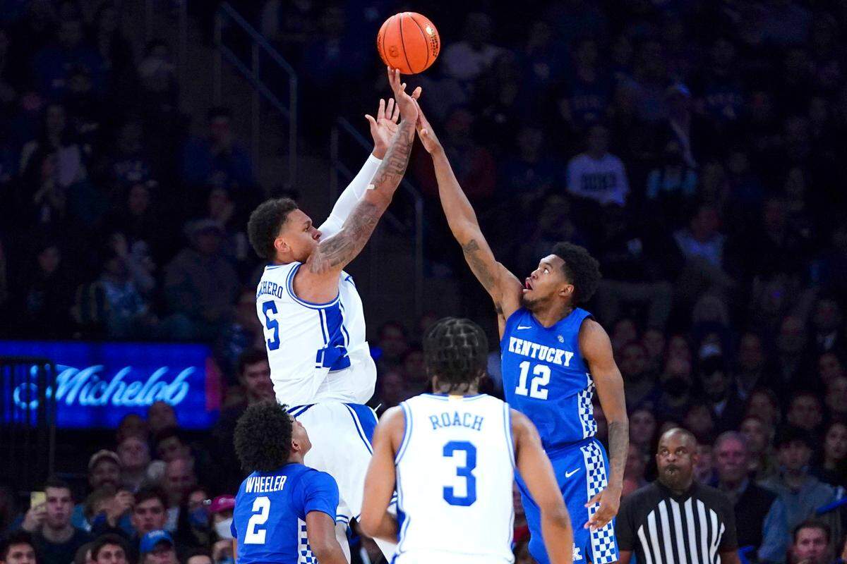 Duke’s Paolo Banchero (5) shoots over Kentucky’s Keion Brooks Jr. (12) during the second half of an NCAA college basketball game Tuesday, Nov. 9, 2021, in New York. Duke won 79-71.