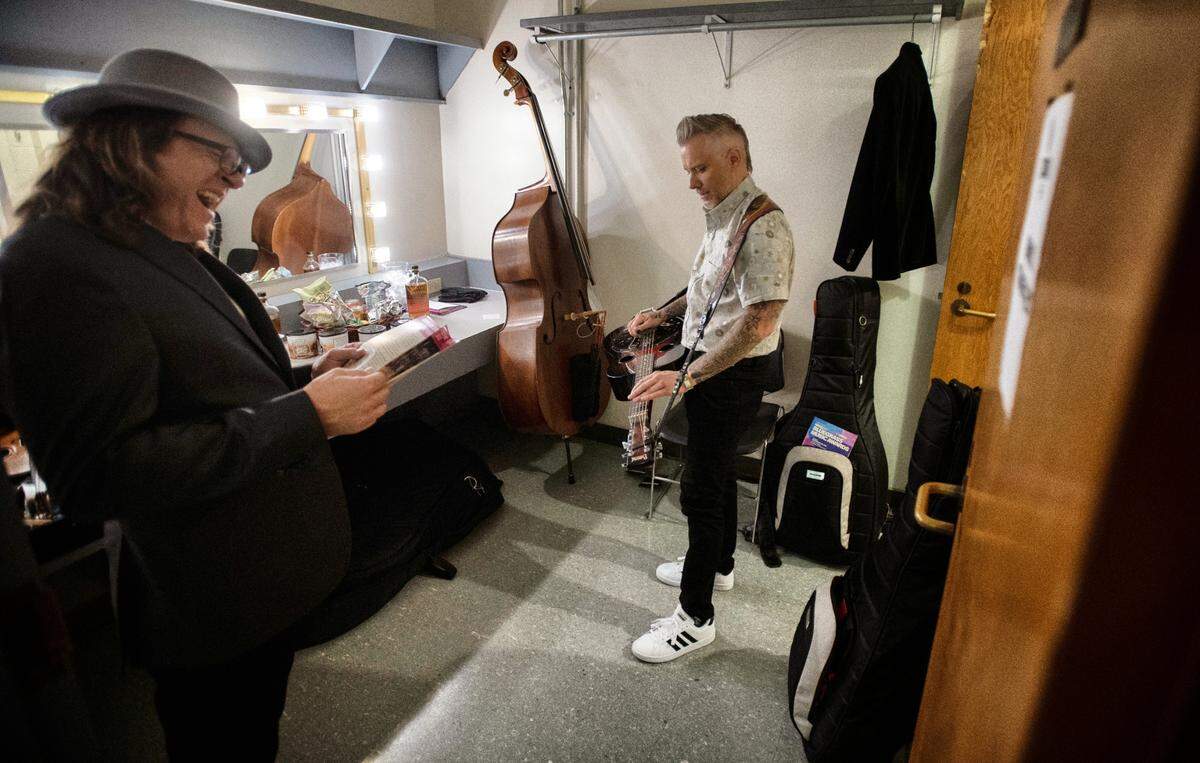 Infamous Stringdusters dobro player Andy Hall (right) and fiddle player Jeremy Garrett warm up before performing at and hosting the at the 32nd Annual IBMA Bluegrass Music Awards in Raleigh, N.C., Thursday night, Sept. 30, 2021.