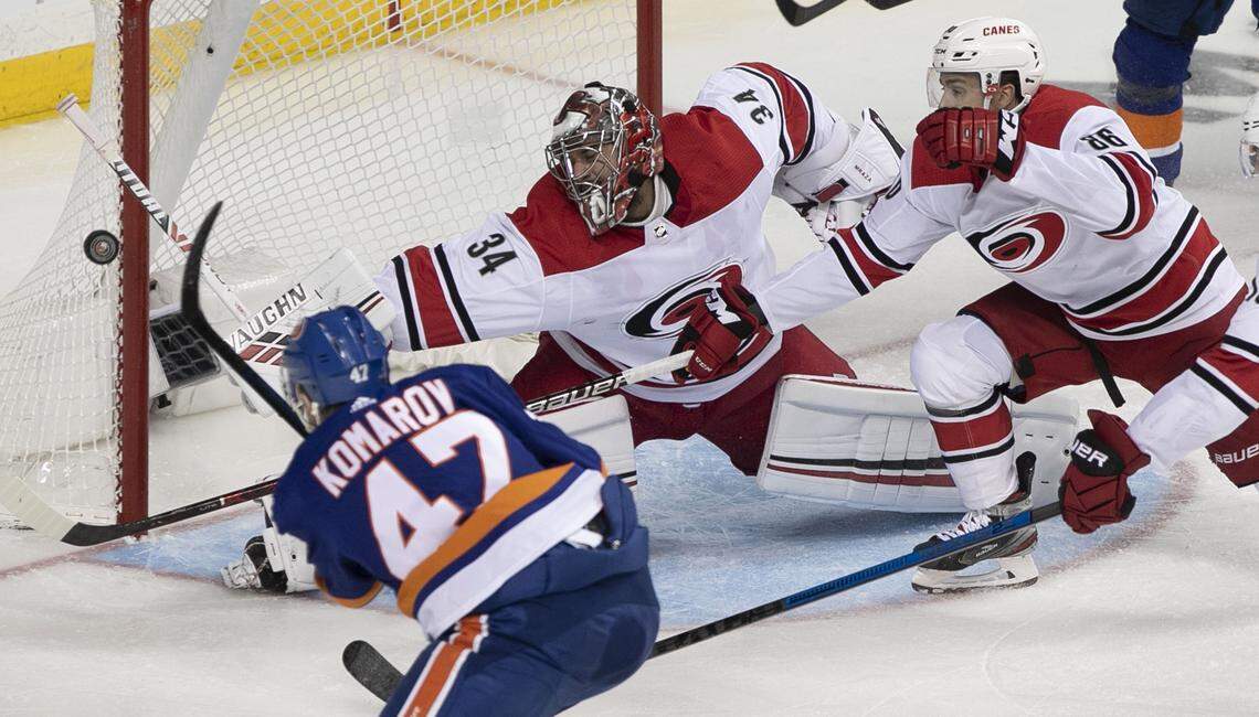 New York Islanders’ Leo Komarov (47) shoots on Carolina Hurricanes goalie Petr Mrazek (34) in the second period during Game 2 of the second round Stanley Cup series on Sunday, April 28, 2019 a Barclays Center in Brooklyn, N.Y.