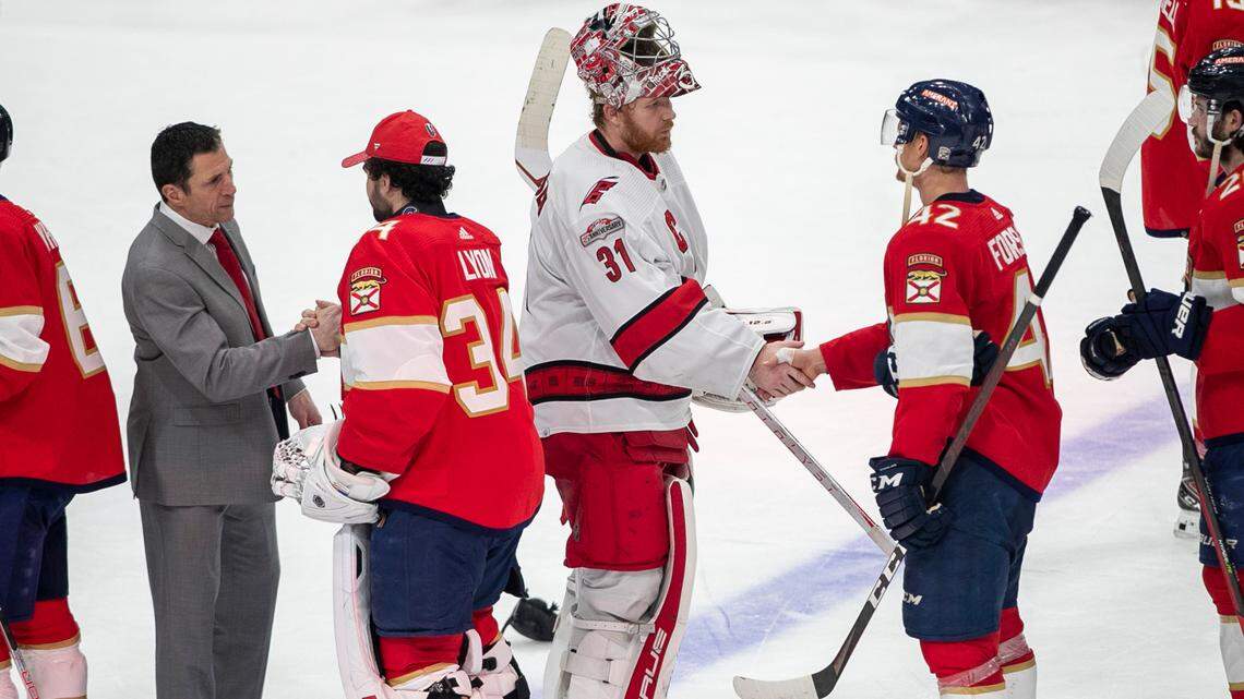 Carolina Hurricanes coach Rod Brind’Amour shakes hands with the Florida Panthers goalie Alex Lyon (34) as Frederik Andersen (31) congratulates Gustav Formling (42) following the Panthers’ 4-3 victory in the Eastern Conference Finals on Wednesday, May 24, 2023 at FLA Live Arena in Sunrise, Fla.