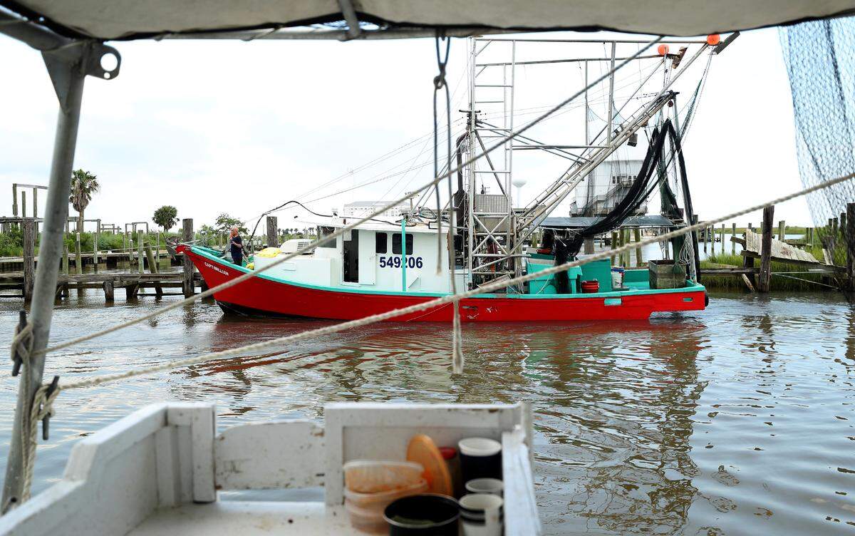 A shrimp boat makes its way to the docks at Bayou Caddy in Hancock County on Thursday, July 29, 2021.
