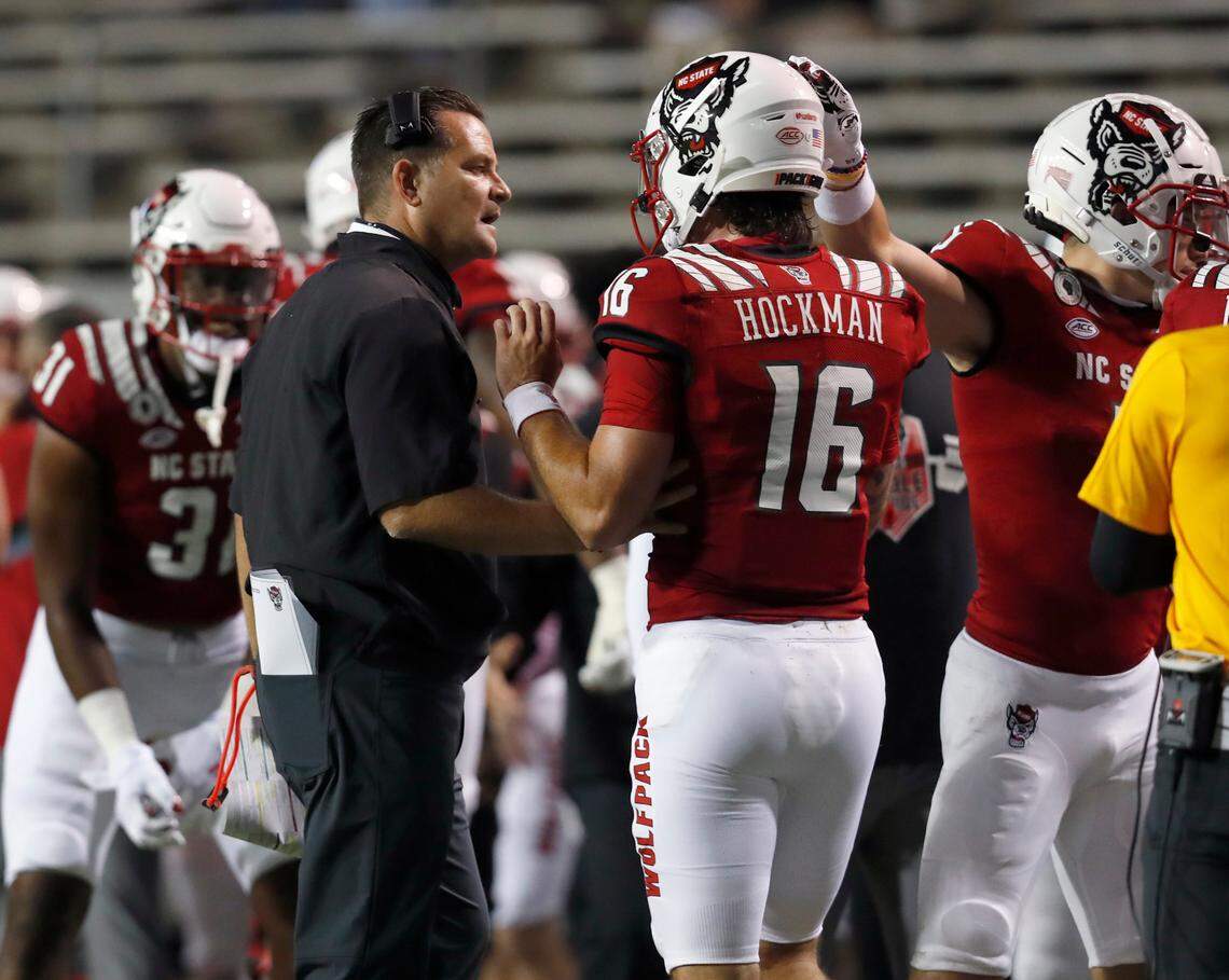 Offensive coordinator Tim Beck talks with quarterback Bailey Hockman (16) during the first half of N.C. State’s game against Wake Forest at Carter-Finley Stadium in Raleigh, N.C, Saturday, Sept. 19, 2020.