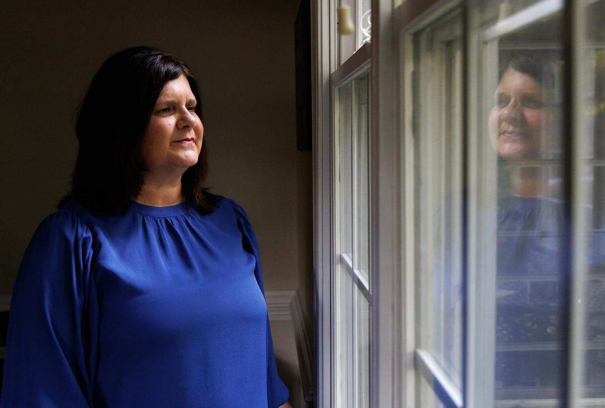 Sarah Cope, poses for a portrait on Tuesday, June 17, 2025, at her home in Garner, N.C. Cope’s mother, who was diagnosed with dementia, lives in a nursing home in Harnett County. Without Medicaid coverage, Cope says she’s unsure how her family would care for her mother.
